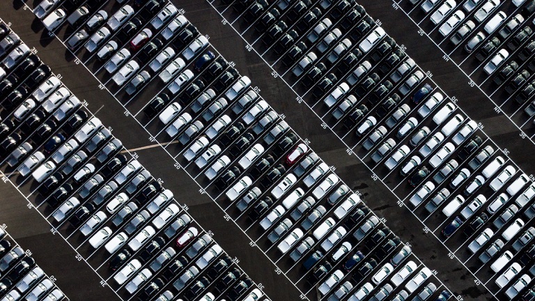 A parking lot full with parked cars
