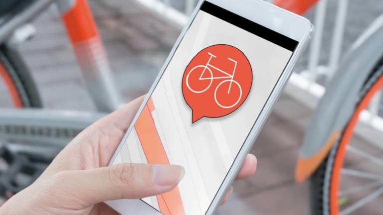 Illustration of a person using mobile application for bikes 