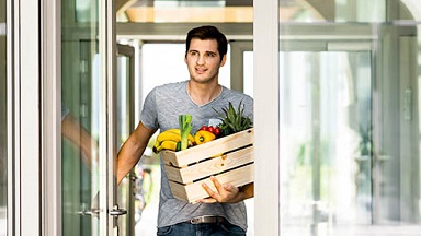 A person carrying fruits and vegetables