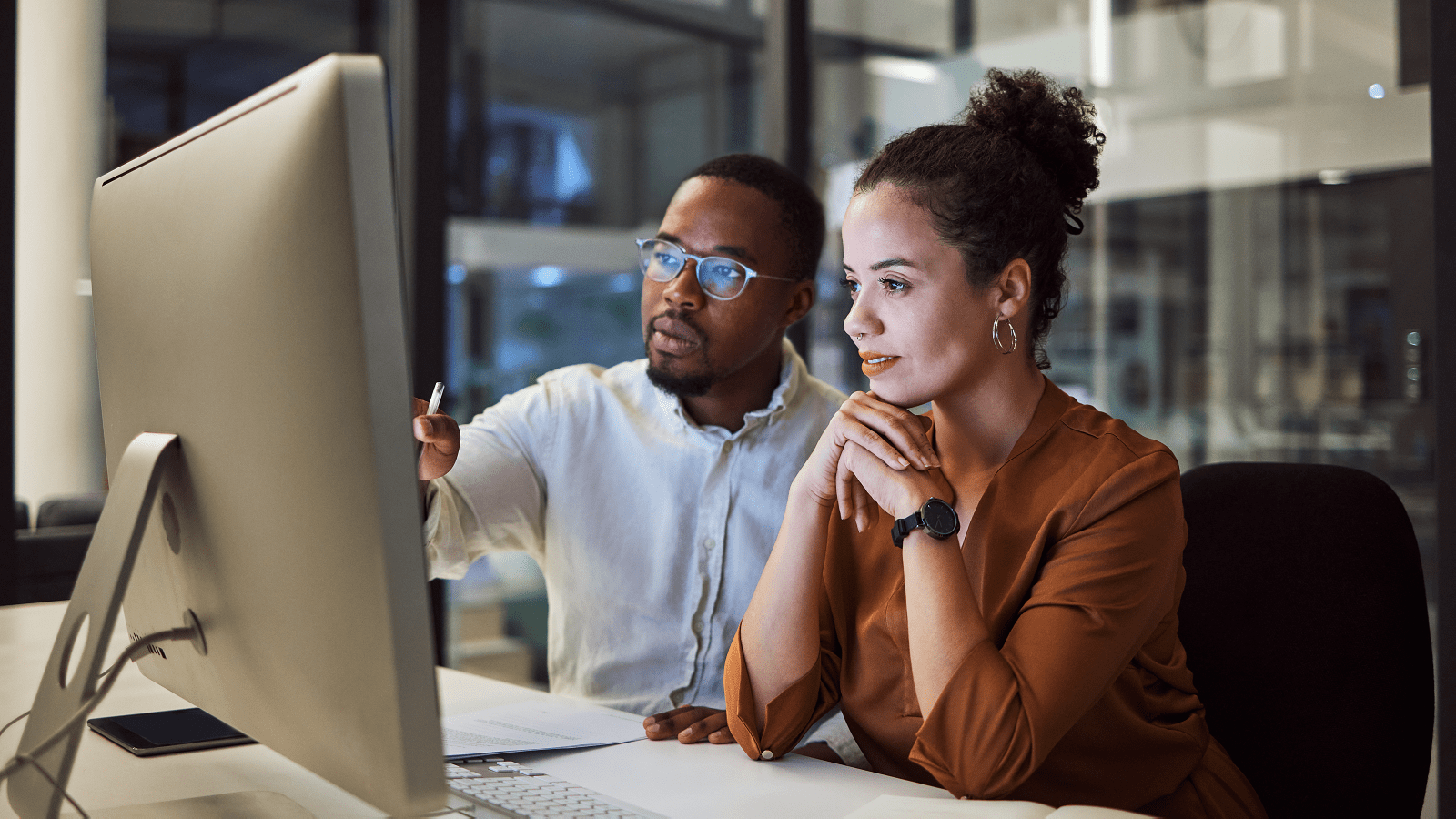 Two people looking at screen as part of Generative AI for business