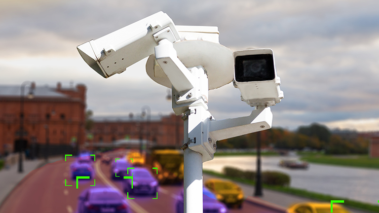 Camera surveilling street and tracking cars